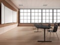 Modern wooden classroom interior with table in row and chalkboard mockup Royalty Free Stock Photo