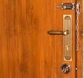 Modern Wooden Door Handle with security chained lock.jpg Royalty Free Stock Photo