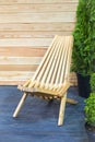 Modern wooden folding deckchair concept. Design interior hardwood garden chair