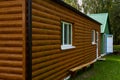 Modern wooden house. Beautiful country house made of ecological materials. Construction of private houses made of timber