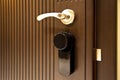 Modern wooden looking steel door, security electronic lock system Royalty Free Stock Photo