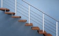 Modern wooden staircase with chromed railing