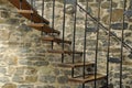 Modern wooden stairs at a medieval wall Royalty Free Stock Photo