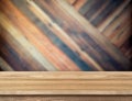 modern wooden table top at blurred diagonal wood plank wall,Template mock up for display or montage of product.