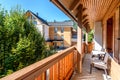 Modern wooden terrace - balcony with table and chairs.