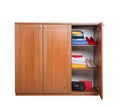 Modern wooden wardrobe with clothes and shoes on white Royalty Free Stock Photo