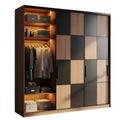 Modern Wooden Wardrobe with Sliding Doors and Interior Lighting Royalty Free Stock Photo
