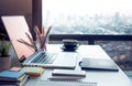 Modern work table with computer laptop and cityscapes view.from window.Business concepts ideas Royalty Free Stock Photo