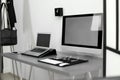 Modern workplace interior with computers on table. Royalty Free Stock Photo