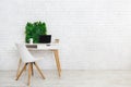 Modern workplace with laptop and flowerbox, empty space Royalty Free Stock Photo