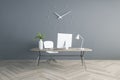 Modern workplace in light room with modern computer on stylish table on wooden floor and grey wall Royalty Free Stock Photo