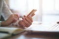 Modern workplace woman using mobile phone in office. Royalty Free Stock Photo