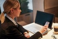 Modern workplace woman using mobile phone in office Royalty Free Stock Photo