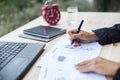 Modern workplace woman using mobile phone sitting at wooden table in office Royalty Free Stock Photo