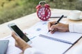 Modern workplace woman using mobile phone sitting at wooden table in office Royalty Free Stock Photo