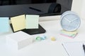 Modern workspace background. Workplace with a clock, office supplies and sticky notes Royalty Free Stock Photo