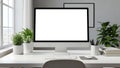 Modern workspace with blank desktop computer screen and plants Royalty Free Stock Photo