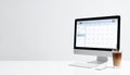 Modern Workspace with Calendar on Desktop Computer Screen Royalty Free Stock Photo