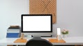 Modern workspace with computer, smart phone, and office supplies on white desk. Royalty Free Stock Photo