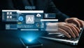 Modern workspace featuring AI technology with a laptop and smartphone showcasing data analytics and cloud computing in a Royalty Free Stock Photo