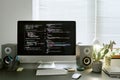 Modern Workspace Featuring Computer Monitor Displaying Programming Code Royalty Free Stock Photo