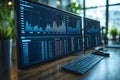 a modern workspace featuring dual monitors displaying financial data, a sleek keyboard, and a mouse, set against a blurred backgro Royalty Free Stock Photo