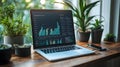 a modern laptop displaying colorful bar charts and data analytics on screen placed on wooden desk near green plants and smartphone Royalty Free Stock Photo