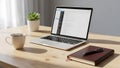 Modern workspace with laptop, coffee, and notebook on wooden desk Royalty Free Stock Photo