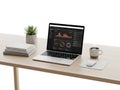 Modern workspace with laptop and data analytics Royalty Free Stock Photo