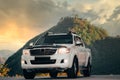 Modern 4x4 Pick-up truck on nature against to mountain in sunset Royalty Free Stock Photo