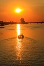 Modern yacht sailing on the Dnieper river at sunset in Dnipro, Ukraine Royalty Free Stock Photo