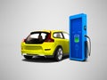 Modern yellow electric car with column for refueling electricity