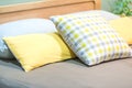 Modern yellow fabric pillows on the bed interior for home and living achitecture decoration contemporary comfortable relaxation