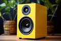 Modern yellow powerful audio speaker on yellow background, space for text