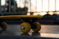 Modern yellow skateboard on top of ramp outdoors, closeup Royalty Free Stock Photo