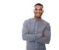 Modern young black man smiling with arms crossed