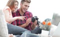 Modern young couple checks the photos on the camera Royalty Free Stock Photo