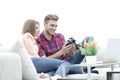 Modern young couple checks the photos on the camera Royalty Free Stock Photo