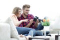 Modern young couple checks the photos on the camera Royalty Free Stock Photo