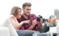 Modern young couple checks the photos on the camera Royalty Free Stock Photo