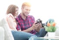 Modern young couple checks the photos on the camera Royalty Free Stock Photo