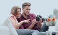 Modern young couple checks the photos on the camera Royalty Free Stock Photo