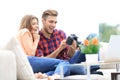 Modern young couple checks the photos on the camera Royalty Free Stock Photo