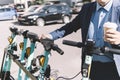 modern young man on an electric scooter in the city. Walk and rent eco-friendly electric vehicles. alternative commute Royalty Free Stock Photo