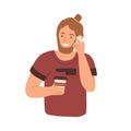 Modern young man holding paper cup with hot coffee and chatting on mobile phone. Bearded guy talking on cellphone with Royalty Free Stock Photo