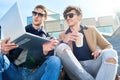 Modern Young Men Using Laptop in City Royalty Free Stock Photo