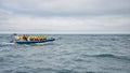 Modern Zodiac boat for big group of tourists is leaving the harbor of Husavik for whale watching safari, Iceland