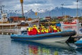 Modern Zodiac boat for big group of tourists is leaving the harbor of Husavik for whale watching safari, Iceland