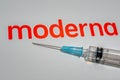 Moderna logo with a syringe for coronavaccine