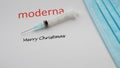 Moderna logo with a syringe and a face mask